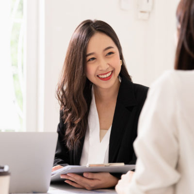 Human resources manager conducting job interview with applicants in office